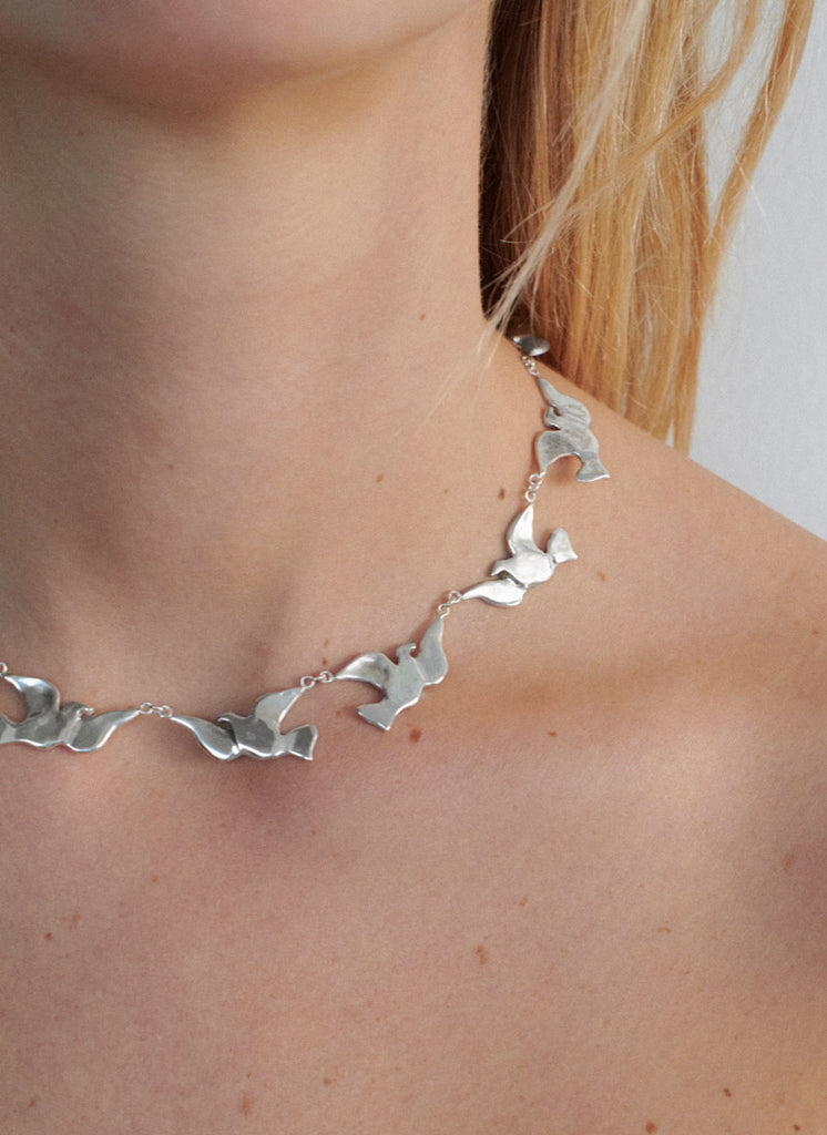 a dozen doves necklace